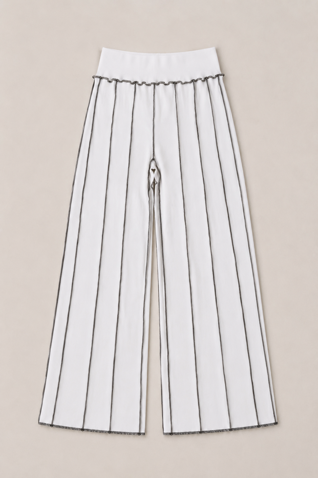 White wide-leg cropped pants with thin vertical black pinstripes and a ruffled waistband, shown flat against a light beige background.